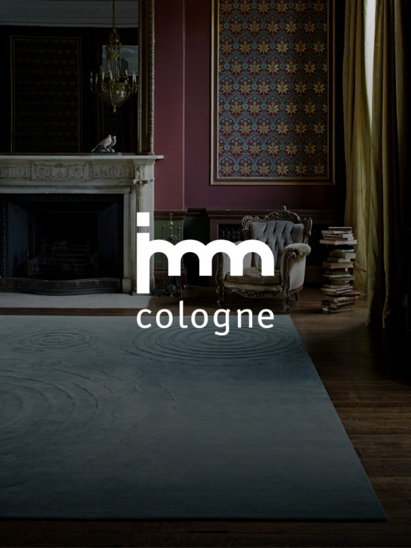 promotional photo for imm Cologne fair of traditional chair and fire place