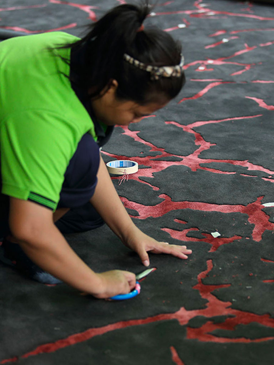 Jab rug in black and red designed by Staffan Tollgard during the making process