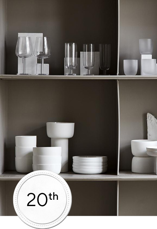 Glass ware and white ceremic collection on a cabinet
