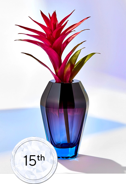 Blue Glass flower jar with pink plant